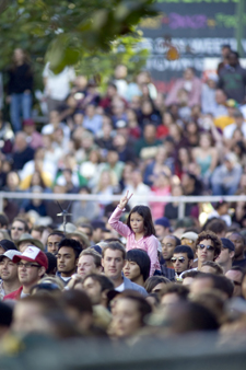 Photo of crowd at Art & Soul with peace sign girl