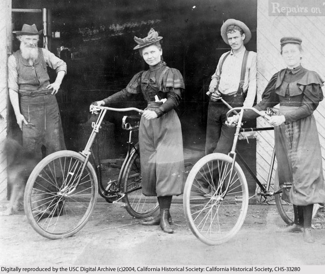 Four women and two men standing in front of a bicycle shop in Monrovia, 1887, California Historical Society Collection at USC, CHS-33280 Four women and two men standing in front of a bicycle shop in Monrovia, 1887, California Historical Society Collection at USC, CHS-33280