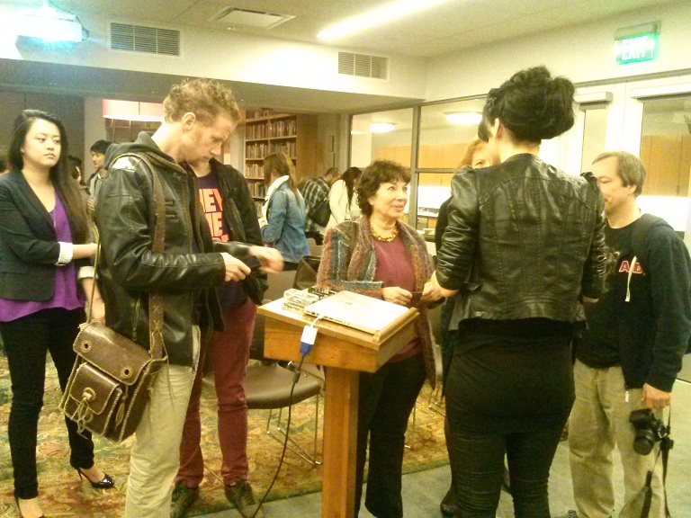 Anouk speaks with guests after her presentation