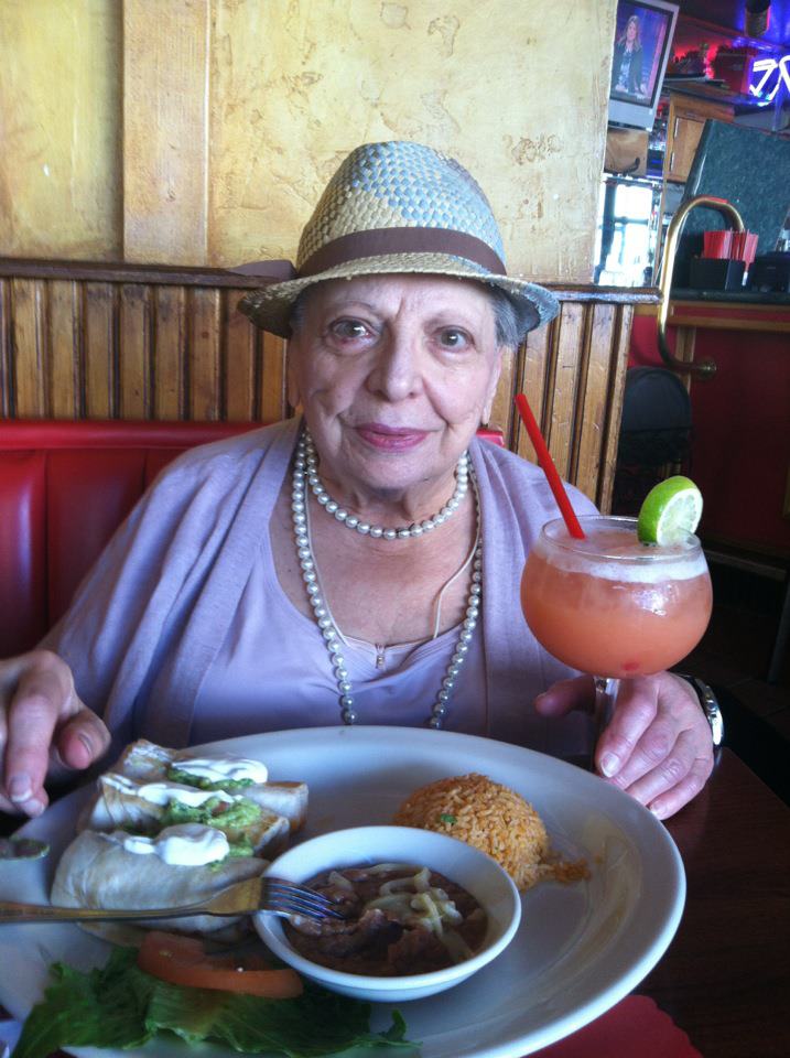 Lunch out with friends at a mexican restaurant with a margarita toast! Elder enjoy a birthday lunch out with a drink