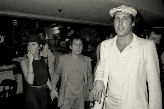Gene Spatz, Chevy Chase, Paul Simon and Carrie  Fisher @ Caddyshack Premiere, 7/25/80. courtesy The Collection of Gene Spatz Photography, LLC.